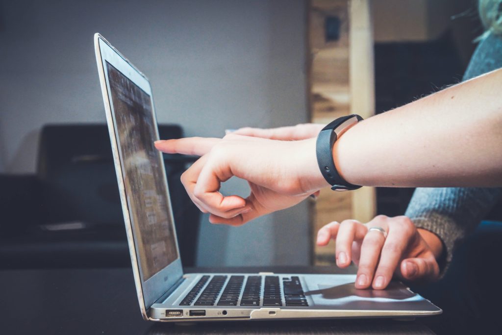 cloud computing and digital transformation on computer with white hands