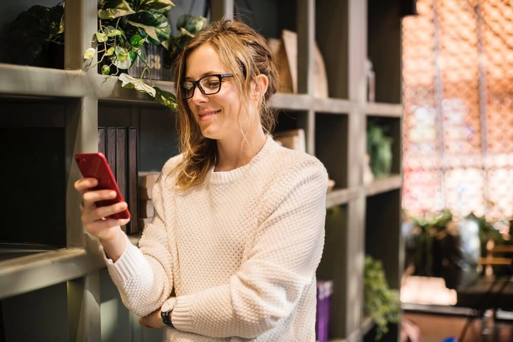woman on phone showcasing right customer fit
