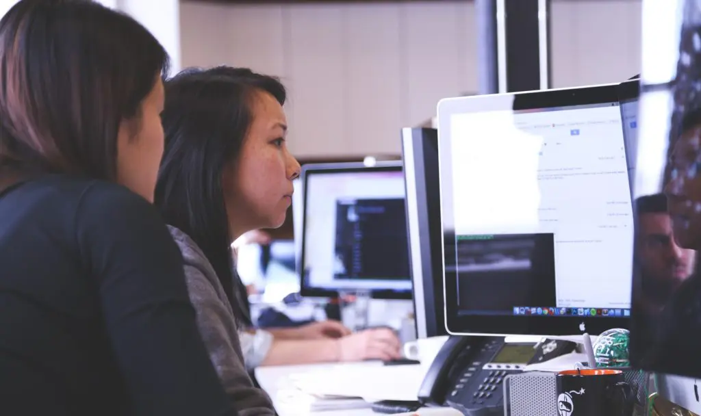 A group of women looking at a computer screen