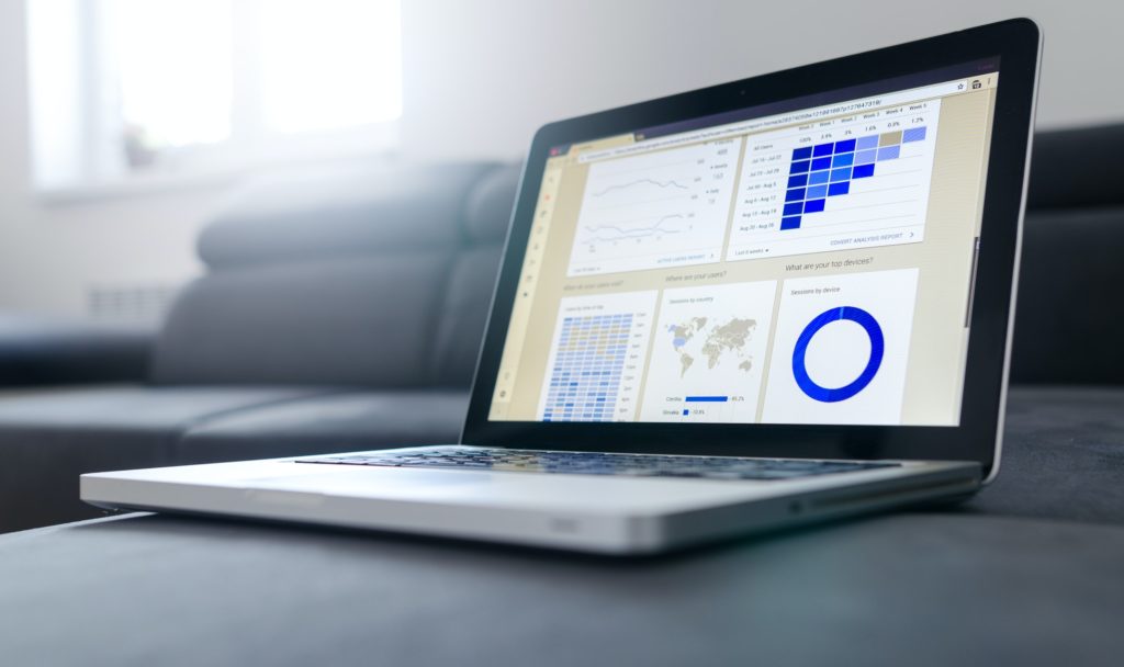 A laptop computer with charts on it