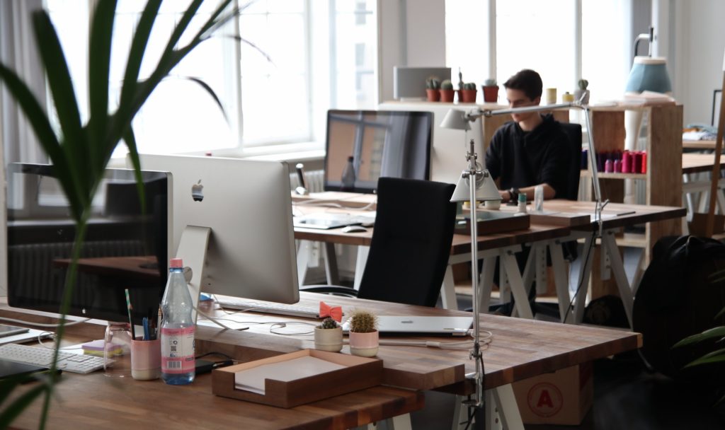 A group of coders at their desks