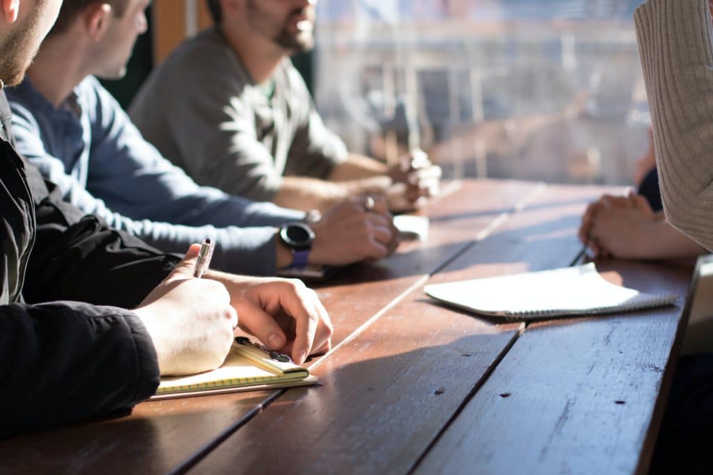 A group of coders at a table